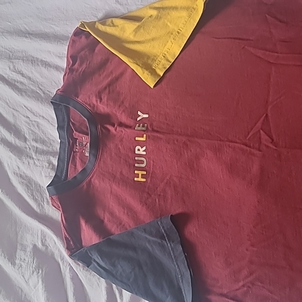 Hurley T-shirt. Burgundy/ yellow and  blue sleeves. Size M